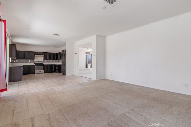 3720 Mount Whitney Ave, Rosamond, CA 93560 - unfurnished living room with light carpet