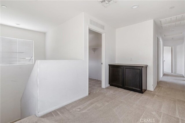 3720 Mount Whitney Ave, Rosamond, CA 93560 - hallway featuring attic access and carpet flooring