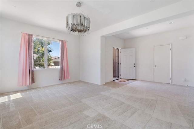 3720 Mount Whitney Ave, Rosamond, CA 93560 - unfurnished room with a chandelier and light colored carpet