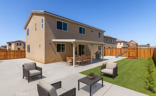 3720 Mount Whitney Ave, Rosamond, CA 93560 - rear view of property featuring a fenced backyard, an outdoor hangout area, a patio area, and a playground