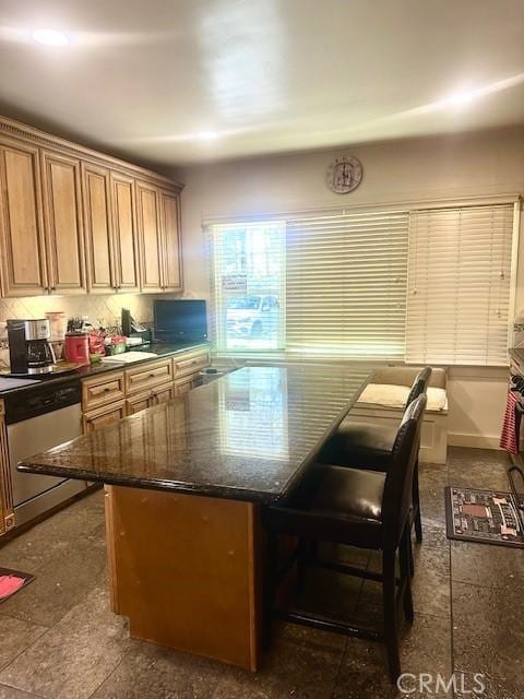 13621 Erwin St, Van Nuys, CA 91401 - kitchen with stainless steel dishwasher, tasteful backsplash, dark stone counters, and a center island