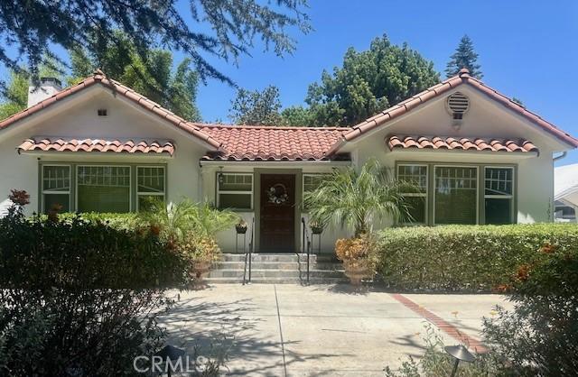 13621 Erwin St, Van Nuys, CA 91401 - mediterranean / spanish home with a tile roof and stucco siding