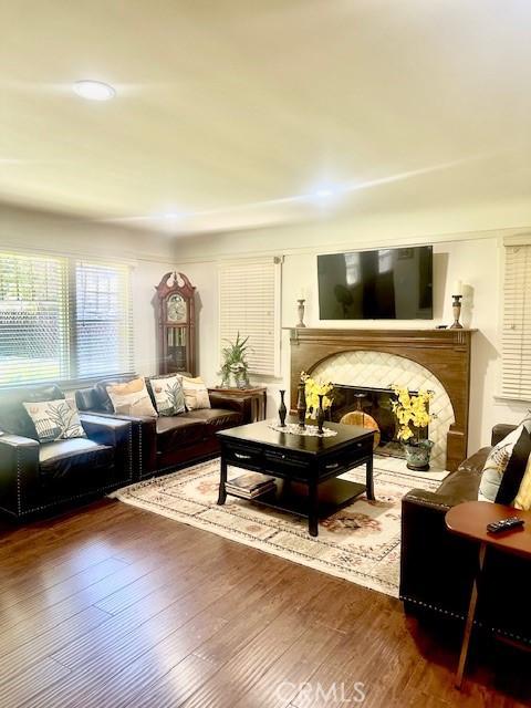 13621 Erwin St, Van Nuys, CA 91401 - living room with wood finished floors and a glass covered fireplace