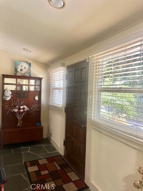 13621 Erwin St, Van Nuys, CA 91401 - foyer featuring baseboards and dark tile patterned floors