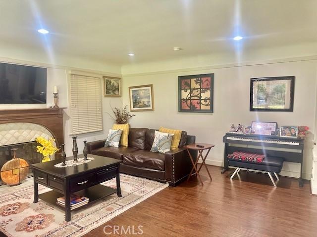 13621 Erwin St, Van Nuys, CA 91401 - living area with wood finished floors, a fireplace, and recessed lighting