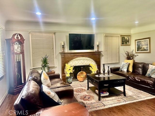 13621 Erwin St, Van Nuys, CA 91401 - living room with wood finished floors, a brick fireplace, and recessed lighting