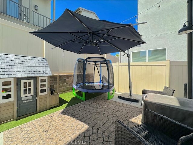 4173 Horvath St Unit 104, Corona, CA 92883 - view of patio with a trampoline