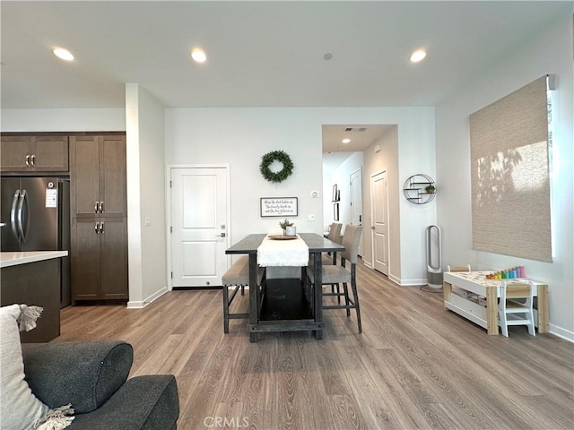 4173 Horvath St Unit 104, Corona, CA 92883 - dining space with light wood-style flooring and recessed lighting