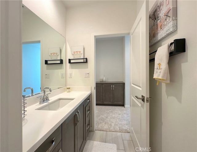 4173 Horvath St Unit 104, Corona, CA 92883 - bathroom with vanity and wood finished floors
