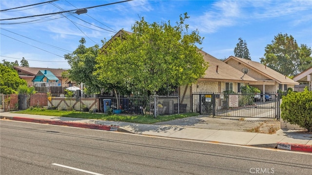 3856 Baldwin Park Blvd Unit B, Baldwin Park, CA 91706 - view of property hidden behind natural elements with a fenced front yard and a gate