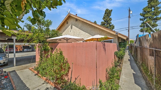 3856 Baldwin Park Blvd Unit B, Baldwin Park, CA 91706 - view of home's exterior with stucco siding and covered parking
