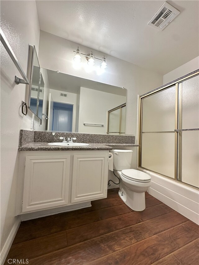16144 Crystal Creek Ln, Cerritos, CA 90703 - full bathroom with wood finished floors, bath / shower combo with glass door, and vanity