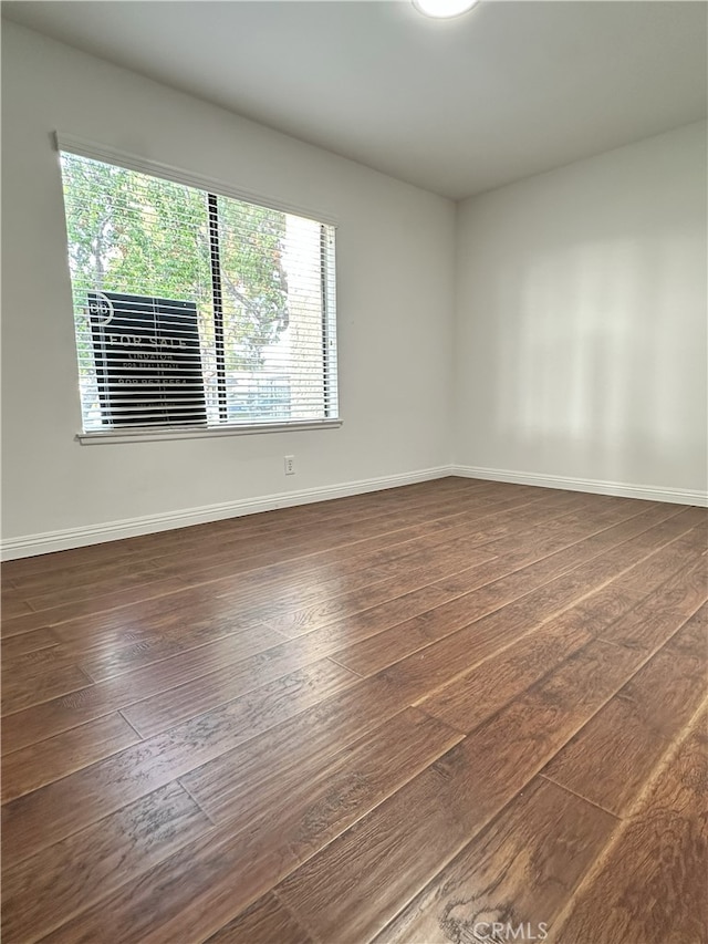 16144 Crystal Creek Ln, Cerritos, CA 90703 - unfurnished room with dark wood-type flooring