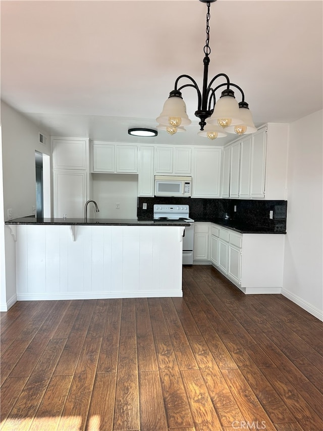 16144 Crystal Creek Ln, Cerritos, CA 90703 - kitchen featuring white appliances, dark wood-style flooring, decorative backsplash, white cabinetry, and dark countertops