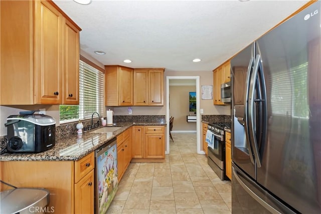 8247 Jennet St, Rancho Cucamonga, CA 91701 - kitchen with stainless steel appliances, dark stone counters, and recessed lighting