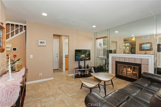 8247 Jennet St, Rancho Cucamonga, CA 91701 - living area with stairs, recessed lighting, and a tiled fireplace