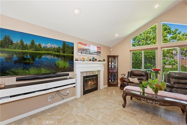 8247 Jennet St, Rancho Cucamonga, CA 91701 - living area featuring a tile fireplace, high vaulted ceiling, and recessed lighting