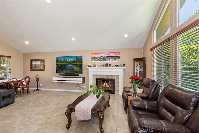 8247 Jennet St, Rancho Cucamonga, CA 91701 - living area with plenty of natural light, recessed lighting, a fireplace, and high vaulted ceiling