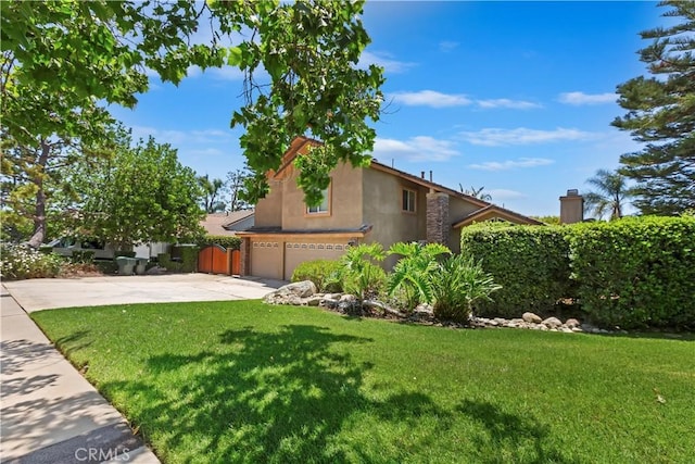 8247 Jennet St, Rancho Cucamonga, CA 91701 - view of side of home with stucco siding, driveway, an attached garage, and a yard