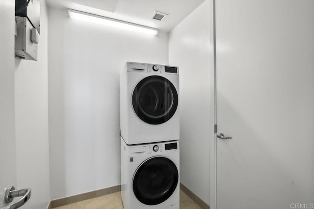 165 6th Ave Unit 2504, San Diego, CA 92101 - laundry room with estacked washer and dryer and baseboards