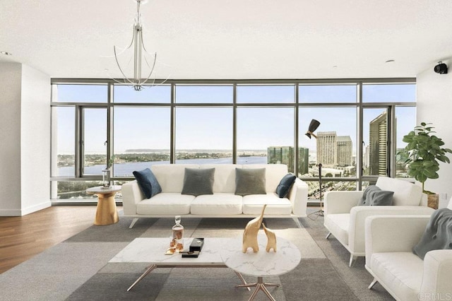 165 6th Ave Unit 2504, San Diego, CA 92101 - living area featuring a wall of windows, wood finished floors, a water view, and a chandelier