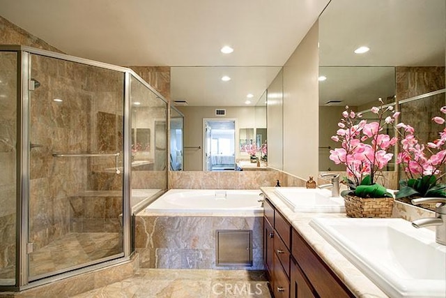 1417 S Westgate Ave Unit 201, Los Angeles, CA 90025 - full bathroom with double vanity, a bath, a shower stall, and recessed lighting