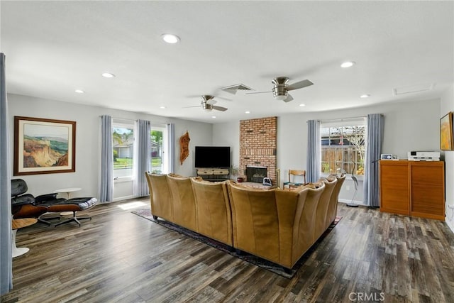 3101 Maple Ave, Fullerton, CA 92835 - living area with dark wood-style flooring, plenty of natural light, recessed lighting, a ceiling fan, and a brick fireplace