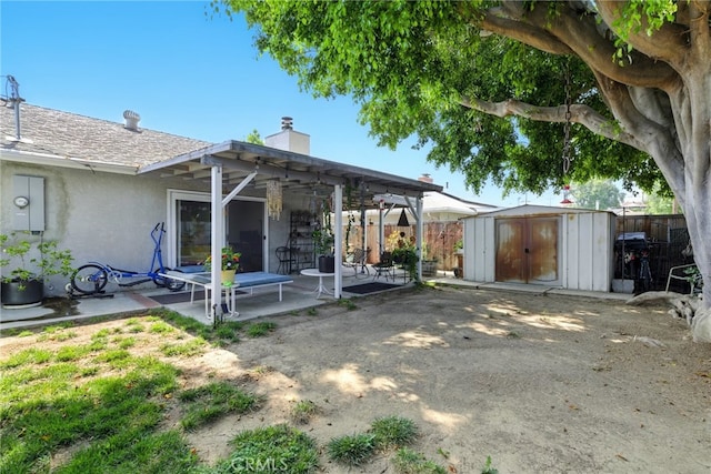 3101 Maple Ave, Fullerton, CA 92835 - back of property with a patio, a storage shed, stucco siding, and a chimney
