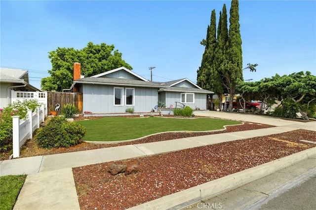3101 Maple Ave, Fullerton, CA 92835 - ranch-style home featuring board and batten siding and a chimney