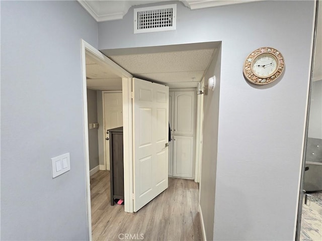 612 N Columbus Ave Unit 101, Glendale, CA 91203 - corridor featuring light wood-style flooring and crown molding