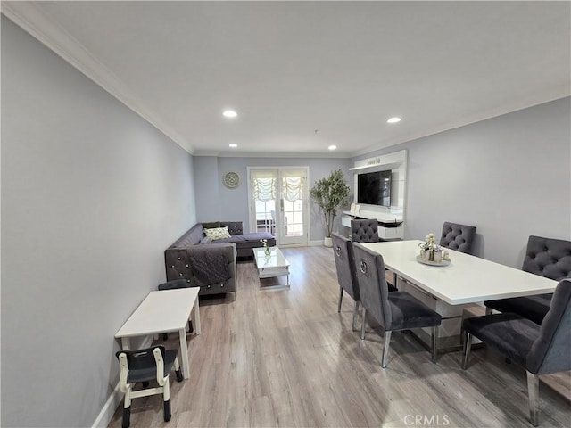 612 N Columbus Ave Unit 101, Glendale, CA 91203 - dining space featuring crown molding, light wood-type flooring, recessed lighting, and french doors