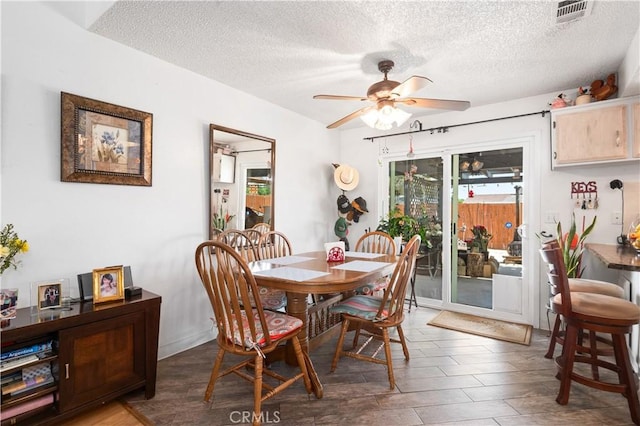 14551 Jelan Ave, Apple Valley, CA 92307 - dining space featuring a textured ceiling, ceiling fan, and wood finished floors