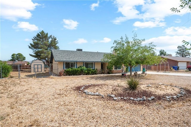 14551 Jelan Ave, Apple Valley, CA 92307 - view of front of house with a gate, a storage unit, and driveway