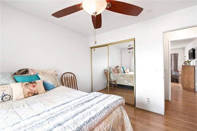 14551 Jelan Ave, Apple Valley, CA 92307 - bedroom featuring wood finished floors, a closet, and ceiling fan