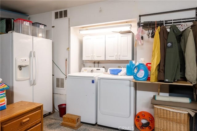 14551 Jelan Ave, Apple Valley, CA 92307 - laundry room featuring washer and clothes dryer and cabinet space