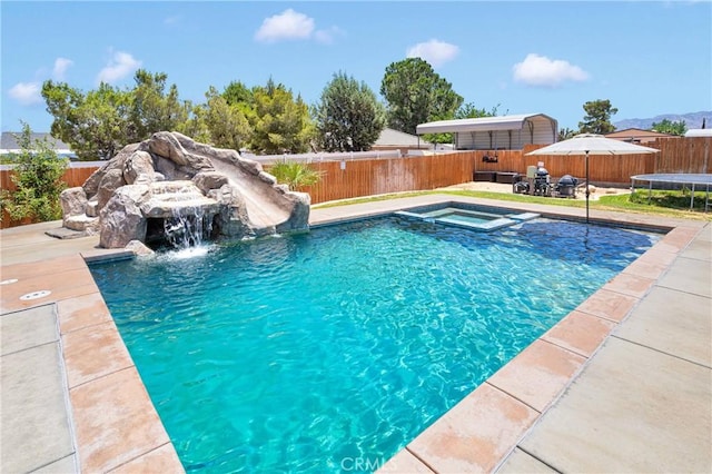 7733 Pismo Ave, Hesperia, CA 92345 - view of pool featuring a fenced backyard, a pool with connected hot tub, and a patio area