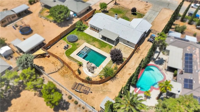 7733 Pismo Ave, Hesperia, CA 92345 - aerial perspective of suburban area featuring a pool area