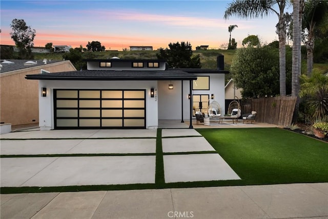 4282 Robbins St, San Diego, CA 92122 - view of front facade featuring concrete driveway, an attached garage, and stucco siding