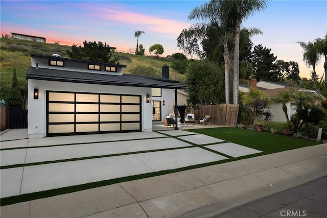 4282 Robbins St, San Diego, CA 92122 - modern home featuring concrete driveway, a garage, and stucco siding