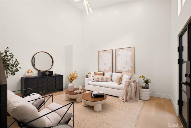 4282 Robbins St, San Diego, CA 92122 - living area featuring wood finished floors and a high ceiling