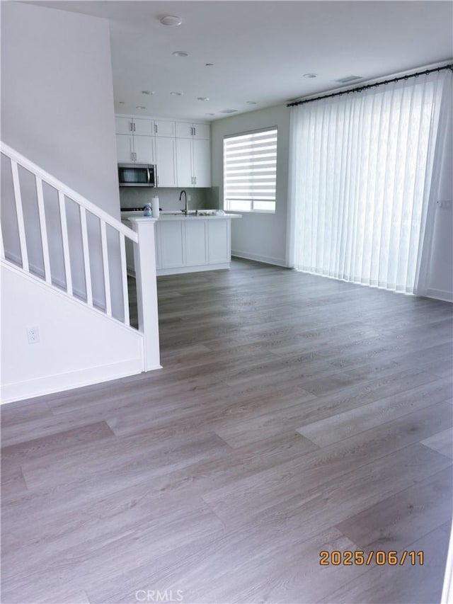 762 Jasper St, Mission Viejo, CA 92694 - unfurnished living room with a sink and light wood finished floors