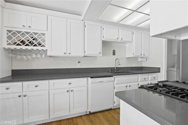 6443 Olive Branch Ln Unit 11, Yorba Linda, CA 92886 - kitchen featuring dishwasher, dark countertops, white cabinetry, and light wood-style flooring