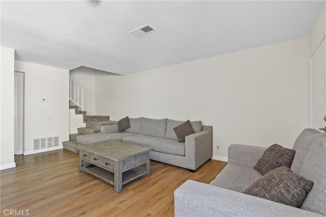 6443 Olive Branch Ln Unit 11, Yorba Linda, CA 92886 - living room featuring wood finished floors and stairway