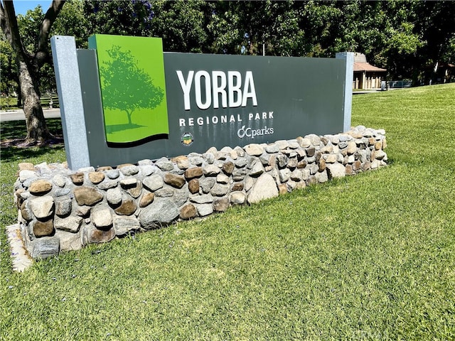 6443 Olive Branch Ln Unit 11, Yorba Linda, CA 92886 - community / neighborhood sign featuring a yard
