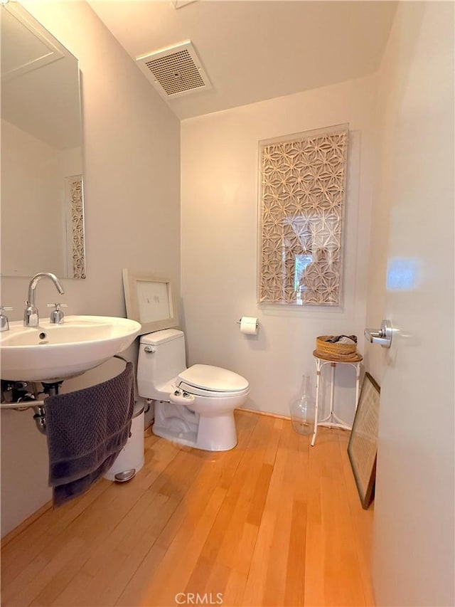 207 Broadway E Unit 302, Long Beach, CA 90802 - bathroom featuring toilet and wood finished floors