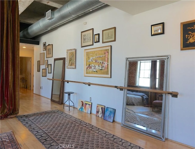 207 Broadway E Unit 302, Long Beach, CA 90802 - corridor featuring wood finished floors and a towering ceiling