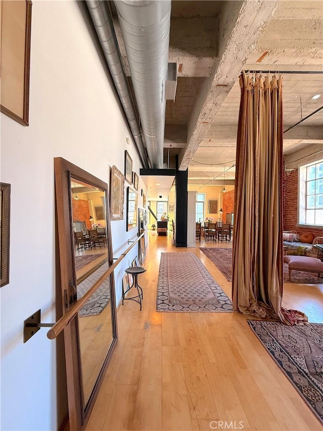 207 Broadway E Unit 302, Long Beach, CA 90802 - corridor featuring light wood-style flooring and beamed ceiling