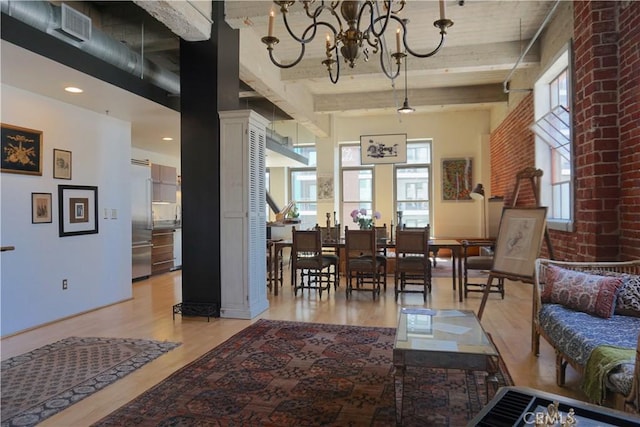 207 Broadway E Unit 302, Long Beach, CA 90802 - living area with healthy amount of natural light, light wood-type flooring, a chandelier, beam ceiling, and ornate columns