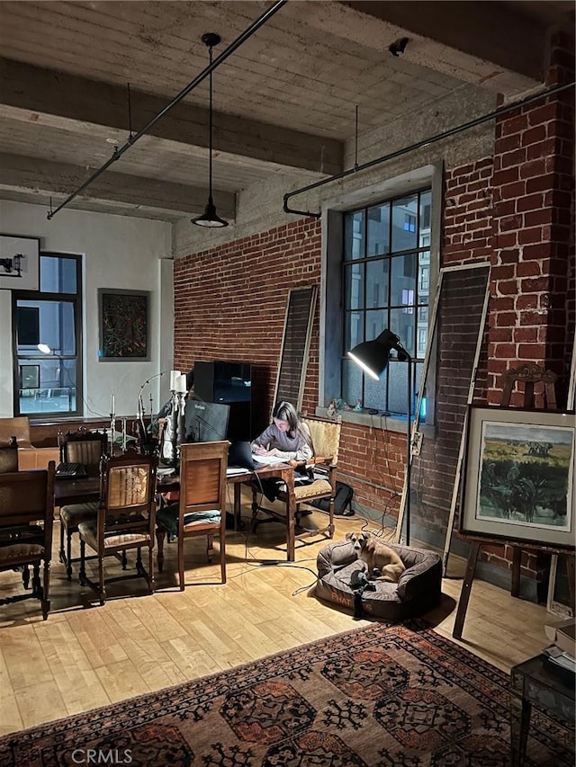 207 Broadway E Unit 302, Long Beach, CA 90802 - dining room featuring hardwood / wood-style floors and brick wall