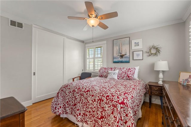1050 Marvista Ave, Seal Beach, CA 90740 - bedroom with wood finished floors, a closet, crown molding, and ceiling fan